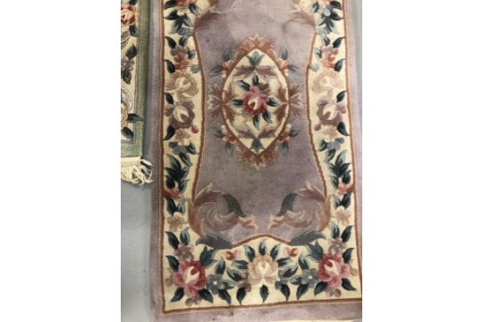 Carpets & Rugs: Chinese hand washed runner, mauve ground, floral decoration in reds, blues, greens - Image 2 of 3