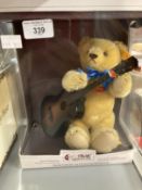 Toys/Collectibles: Steiff musical teddy bear with guitar and music box in its original box.