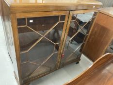 20th cent. Mahogany two door astragal glazed cabinet, moulded top on bracket feet. 48ins. x 48ins. x