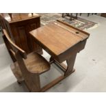 Pre-war oak and elm adjustable flip top child's school desk and bar back chair.