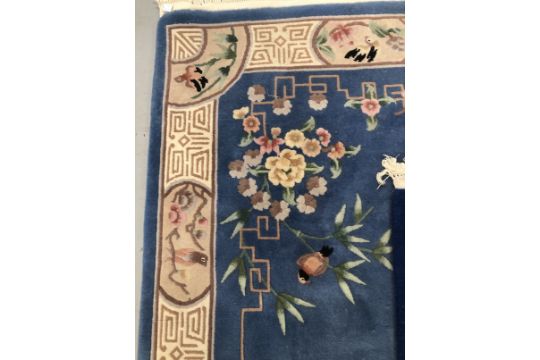 Carpets & Rugs: Chinese hand washed, the first blue ground with avian and floral decoration in - Image 2 of 3