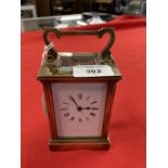 Clocks & Watches: Early 20th cent. Brass carriage timepiece, Roman numerals on enamel face, French