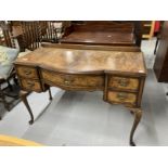 1920s bow front writing desk on cabriole supports with acanthus decoration to the knee. 44ins. x