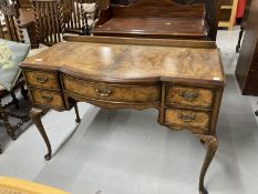 1920s bow front writing desk on cabriole supports with acanthus decoration to the knee. 44ins. x