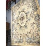 Carpets & Rugs: British made carpet, cream ground with floral decoration, ribbon and garland