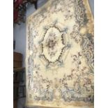 Carpets & Rugs: British made carpet, cream ground with floral decoration, ribbon and garland