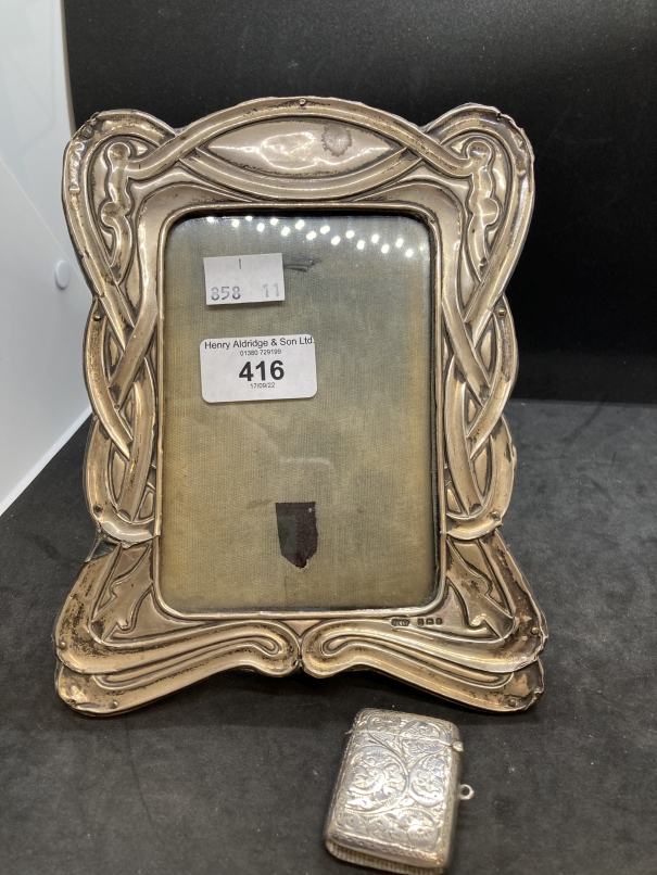 Hallmarked Silver: Photograph frame with ribbon pattern border 7½ins. x 5½ins. Silver Vesta hinged