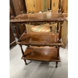 Mahogany four tier whatnot with carved gallery, each shelf with carved moulded edge and pierced