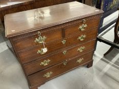 19th cent. Mahogany two over three chest of drawers with a brushing slide above, on bracket supports