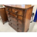 19th cent. Mahogany chest of two over four long drawers, turned knob handles on a plinth base.