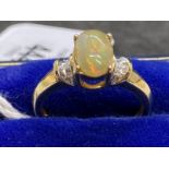 Hallmarked Jewellery: 9ct gold centre claw with an oval cabouchon cut opal, estimated weight 1.25ct,