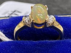 Hallmarked Jewellery: 9ct gold centre claw with an oval cabouchon cut opal, estimated weight 1.25ct,