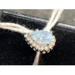Jewellery: White metal ring heart shape cluster, at the centre is a heart shaped aquamarine,