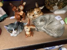 20th cent. Ceramics: Goebel, money box in the form of a sleeping grey cat, cuddling brown rabbits,