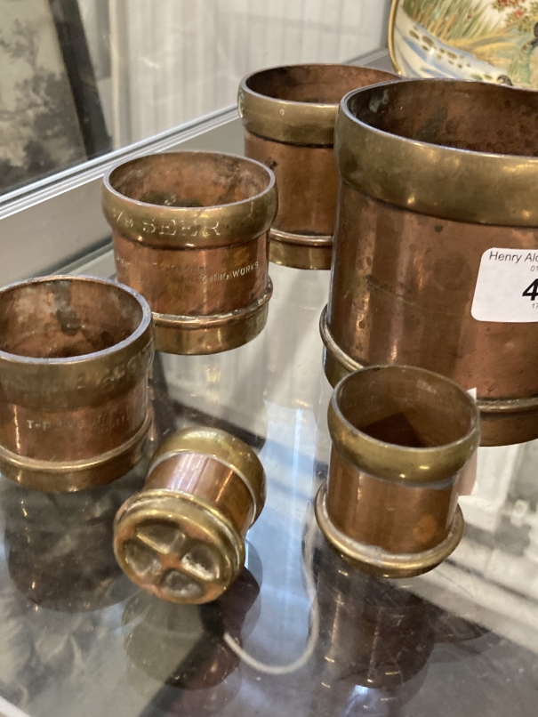 Oriental: Set of six seer measuring cups in copper with brass banding. Sizes from 1/64 to half a - Image 2 of 2