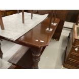 19th cent. Mahogany extending dining table on turned supports with castors, two inserts. Closed