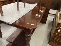 19th cent. Mahogany extending dining table on turned supports with castors, two inserts. Closed