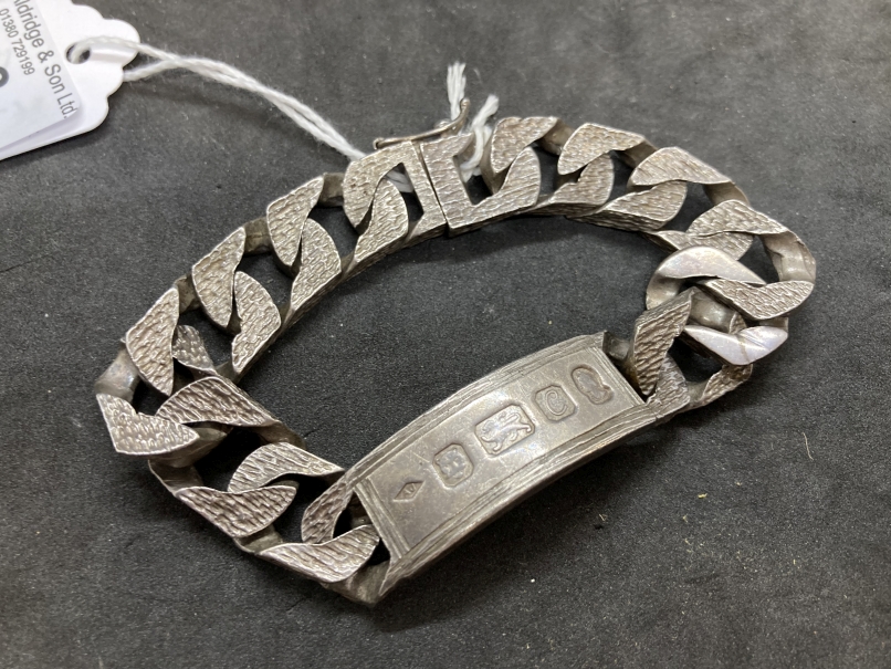 Hallmarked Silver: Identity bracelet bark finished curb links, box clasp, hallmarked London.
