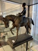 19th/20th cent. Bronze equestrian statue with jockey up, on cast plinth. Height 18ins.