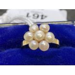 Jewellery: Yellow metal ring in the form of a floral cluster of seven 4mm-3.5mm cultured pearls,