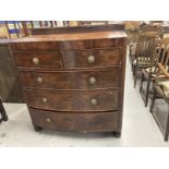 Early 19th cent. Mahogany bow front chest of two over three drawers with a cross banded top, round