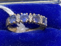 Hallmarked Jewellery: 9ct gold ring half hoop set with four circular cut sapphires, estimated weight