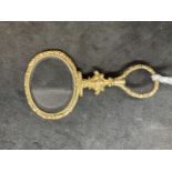 19th cent. Optical Quizing glass, gilt and raised decoration. 2½ins.