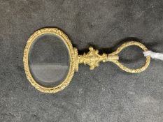 19th cent. Optical Quizing glass, gilt and raised decoration. 2½ins.