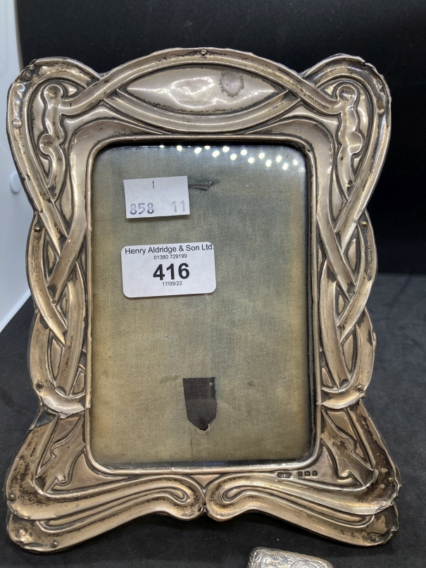 Hallmarked Silver: Photograph frame with ribbon pattern border 7½ins. x 5½ins. Silver Vesta hinged - Image 3 of 3