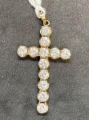 Hallmarked Jewellery: 9ct gold cross 1¾ins. x 1ins. Set with twelve cubic zirconia, hallmarked