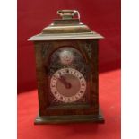 Clocks: 20th cent. Walnut bracket clock by Mercer with caddy top and brass carrying handle. 8ins.