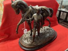 20th cent. Bronze figure of a racehorse and jockey on a marble base, signed and dated. 18½ins.