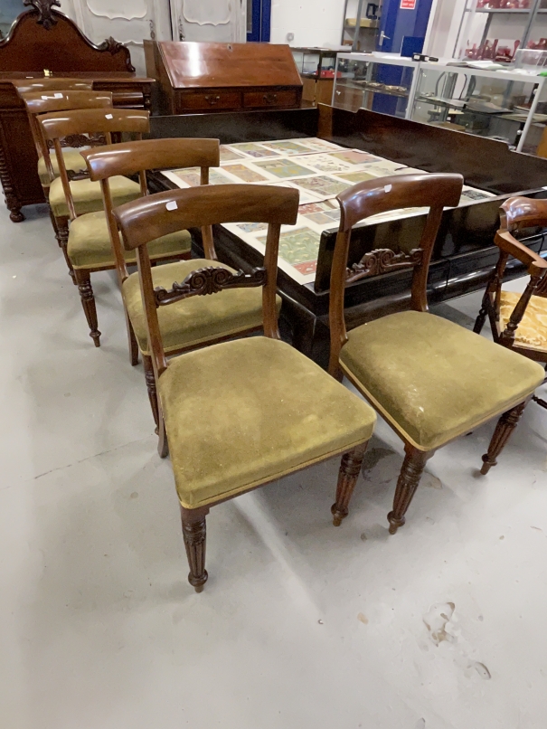 19th cent. Mahogany chairs with bar backs, carved central splat, upholstered seats on reeded legs.