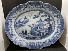 Late 18th cent. Chinese blue and white plate decorated with figures in a landscape with pagodas.