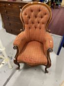 Victorian mahogany upholstered armchair button back with scroll arms, shaped front on cabriole