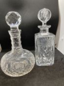 Early 20th cent. Cut glass decanters, one onion shaped, the other decorated with floral images. (2)
