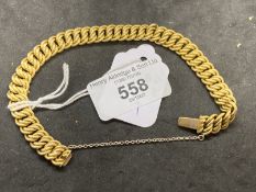 Jewellery: Yellow metal fancy curb link with box and tongue clasp, stamped 15ct, tests as 15ct gold.