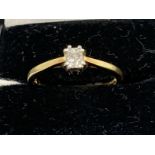 Jewellery: Ring, 18ct gold set with an emerald cut diamond, ring size M. Weight 2.8g.