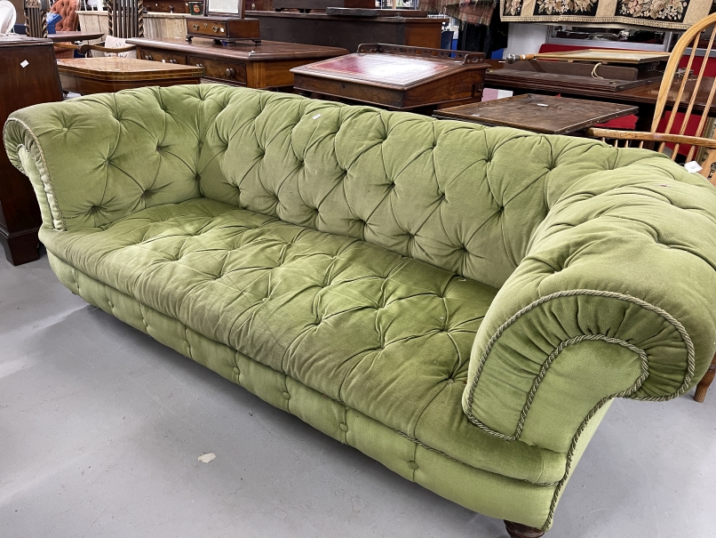 Late 19th cent. Upholstered Chesterfield on turned legs, ceramic castors. 88ins. x 40ins.
