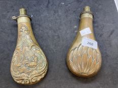 19th cent. Copper and brass powder flasks, one decorated with pheasants in relief. 8ins. (2)