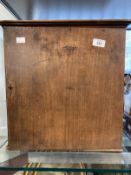 19th cent. Oak table collectors cabinet, hinged door with a bone escutcheon revealing six drawers.