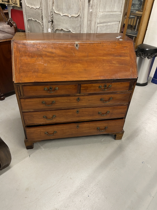 Late 18th cent. Mahogany bureau the hinged fall revealing a fitted interior of drawers and pigeon