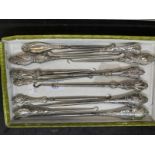 Objects of Virtu: Collection of 19th cent. Silver hallmarked and white metal button hooks. (12)