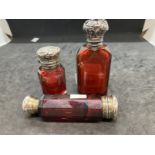 Glass: 19th cent. Ruby glass, white metal topped scent bottles. (3)