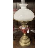 Victorian oil lamp brass base, cranberry glass reservoir, white shade marked Hinks's Duplex. 23½