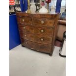 Early 19th cent. Mahogany bow front chest of two over three drawers with a cross banded top, round