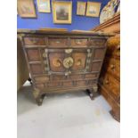 19th cent. Asian, marriage chest decorated with inset yin and yang, with brass mounts. 33ins. x