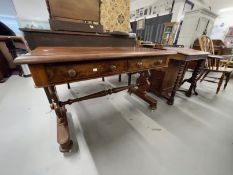 Late 19th cent. Mahogany library table with carved supports terminating in bun feet on castors,