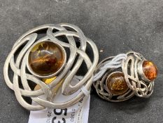 Ismay Collection: Jewellery: White metal brooch and pair of earrings set with a single round amber