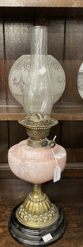 Victorian oil lamp black ceramic base, brass base pink glass reservoir, round etched shade. 23ins.